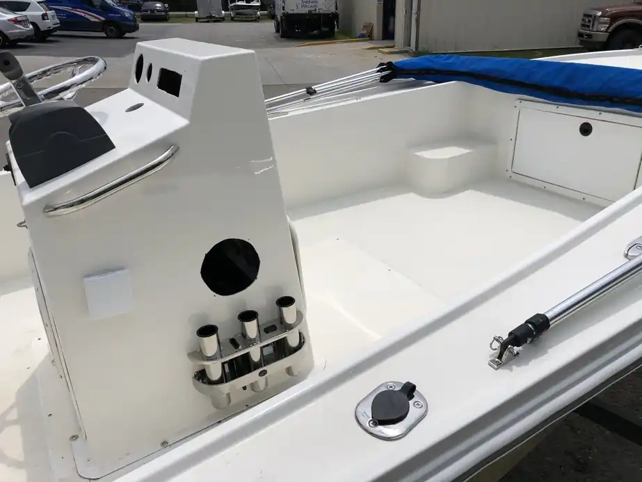 A refinished white console and deck with new rod holders, close detail of the gelcoat